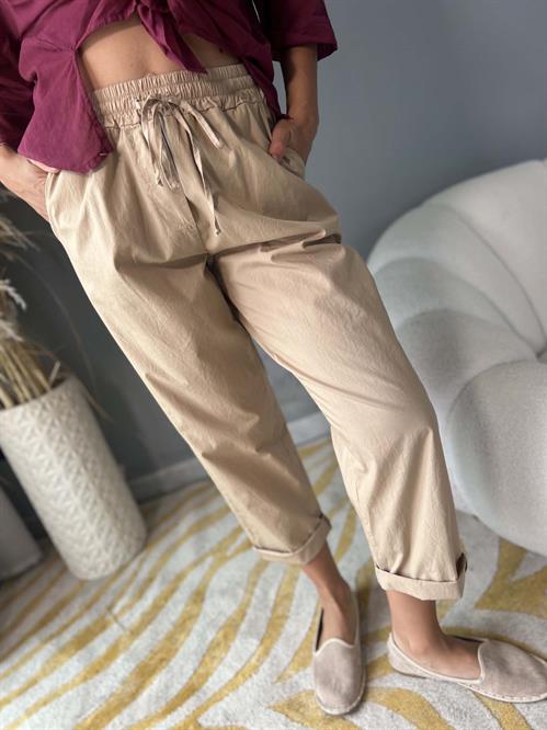 Pantalone in mussola di cotone beige con elastico in vita