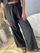 pantalone nero con ricamo infondo con elastico in vita