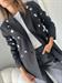 blazer nero con cabochon