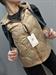 piumino smanicato beige trapuntato con cappuccio