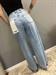 Jeans lavaggio celeste con orlo sfrangiato elastico dietro in vita