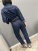 tuta in denim blu con bottoni camicia e cerniera pantalone