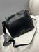 Borsa nera secchiello chiusura chiave lucchetto