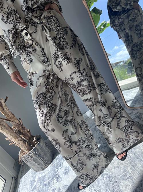 pantalone fantasia stampata palazzo nero e burro